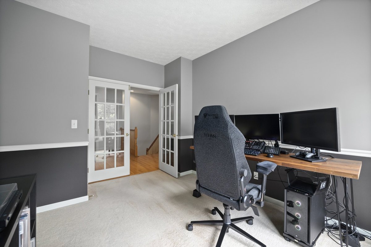 Den with French doors, currently used as an office