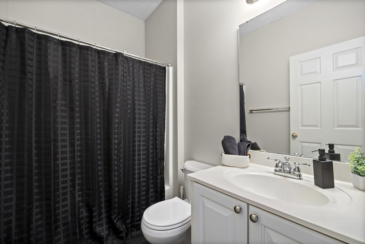 Second full bathroom with tub and shower